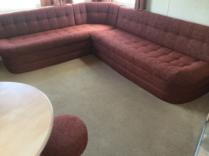 A caravan corner seating area re-upholstered in a hard wearing chenille fabric