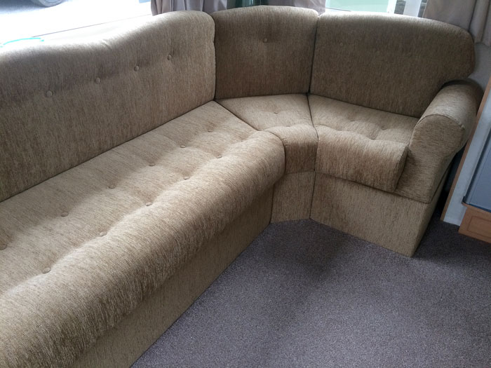 Re-upholstered caravan chairs including shaped backrest cushions, seat cushions, armrests and kickboards