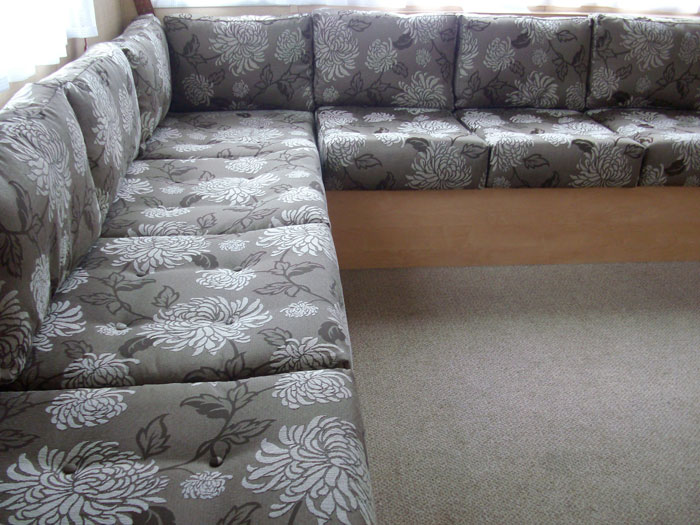 Static caravan seat and backrest cushions re-upholstered in a modern patterned fabric.