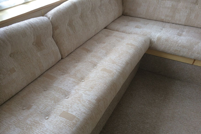 After - the caravan cushions are re-upholstered in a modern fabrics for years more use